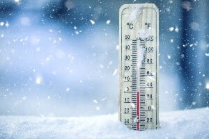 close-up of a thermometer in the snow