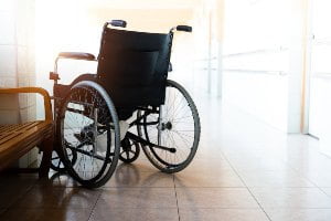 empty wheelchair in empty hallway