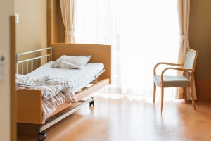 picture of empty bed in nursing home after death of a resident