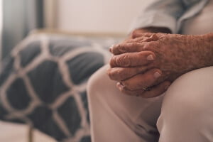 close up of aging hands... waiting for nursing home staff to help